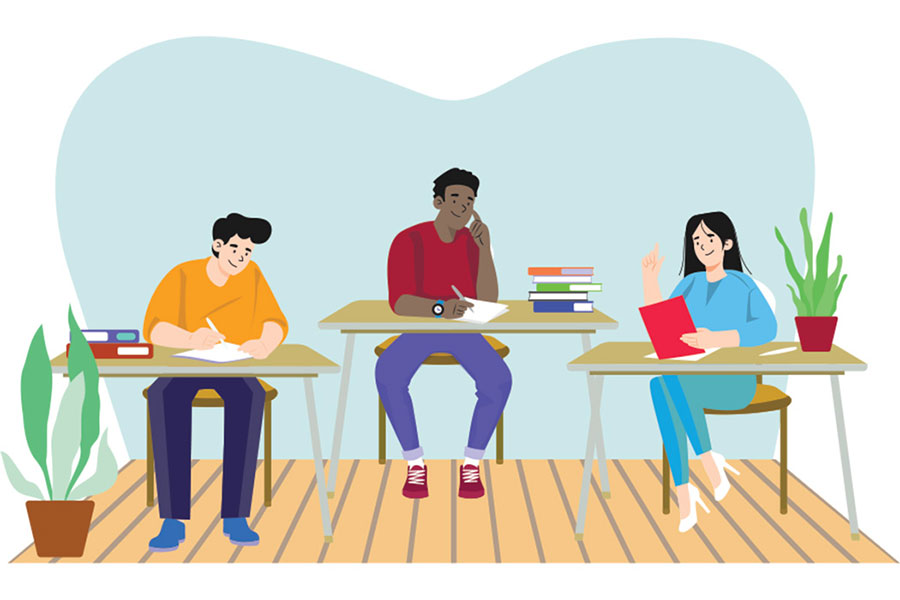 three students sitting at desks