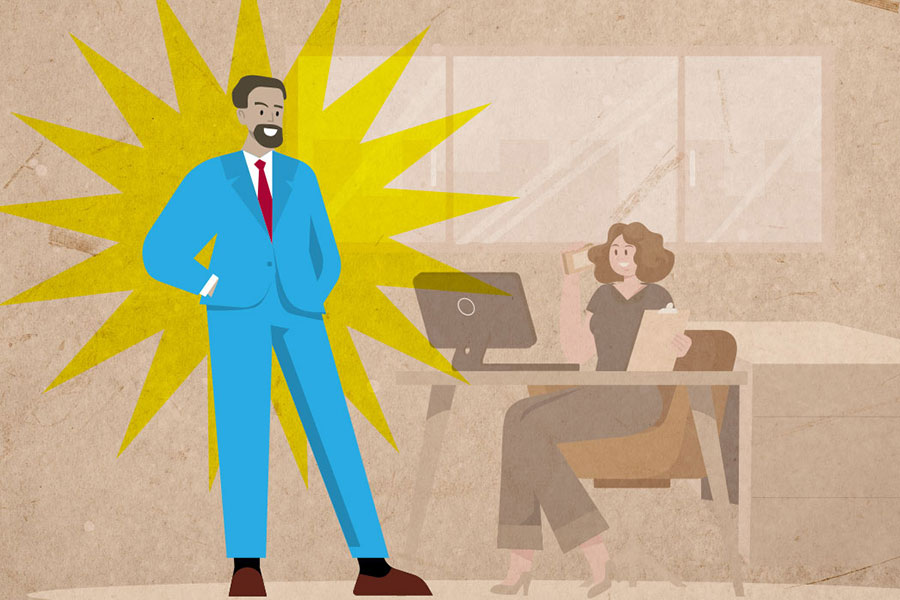 Man standing next to a female co-worker's desk
