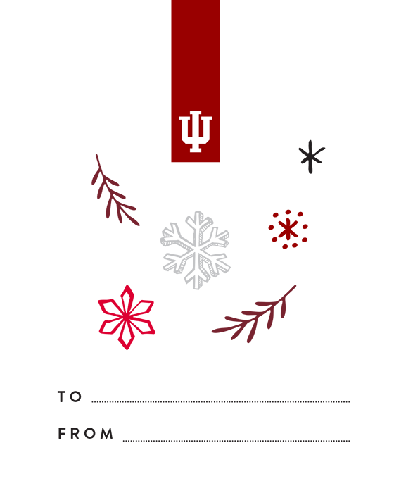 A gift tag with an IU inspired design: a white trident in a crimson tab at the top, as well as snowflakes and branches in shades of red and limestone. At the bottom, there is a blank "To" line and a blank "From" line.