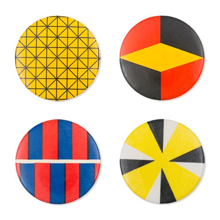 Four multi-colored buttons with geometric designs 