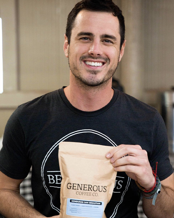 Ben Higgins holds bag of Generous coffee 