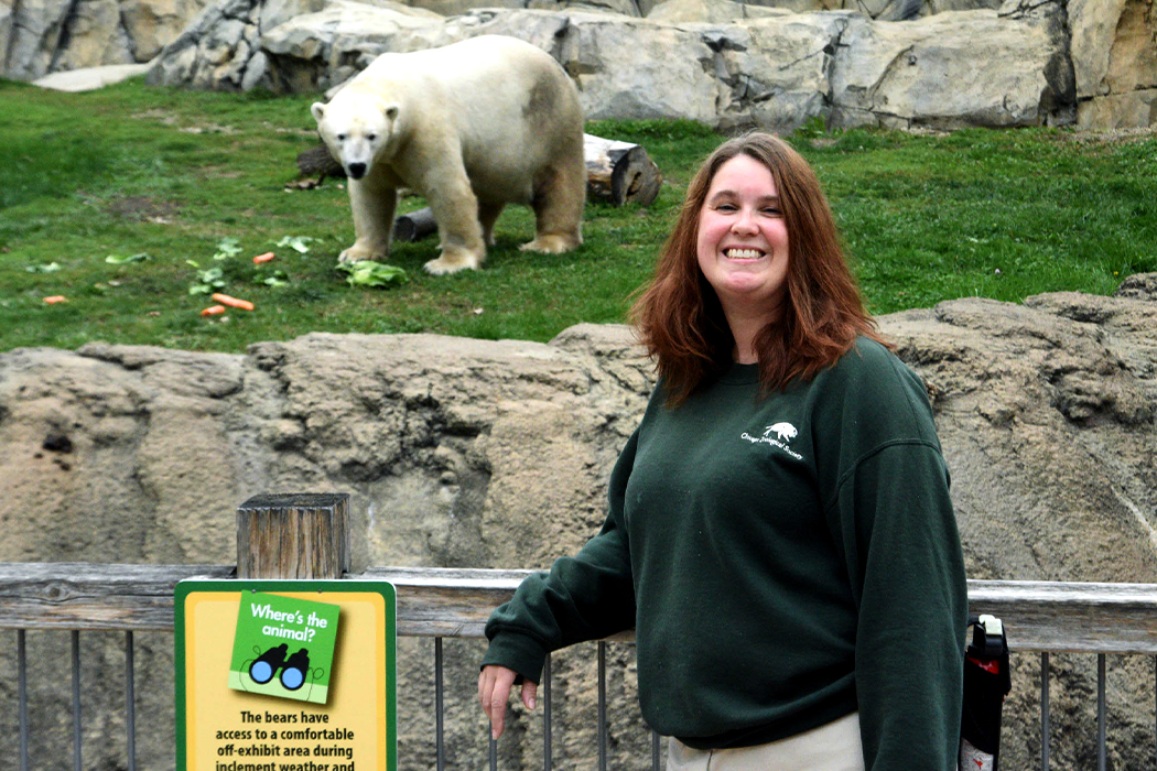 Anne Nichols poses outside of polar bear enclosure at Brookfield Zoo
