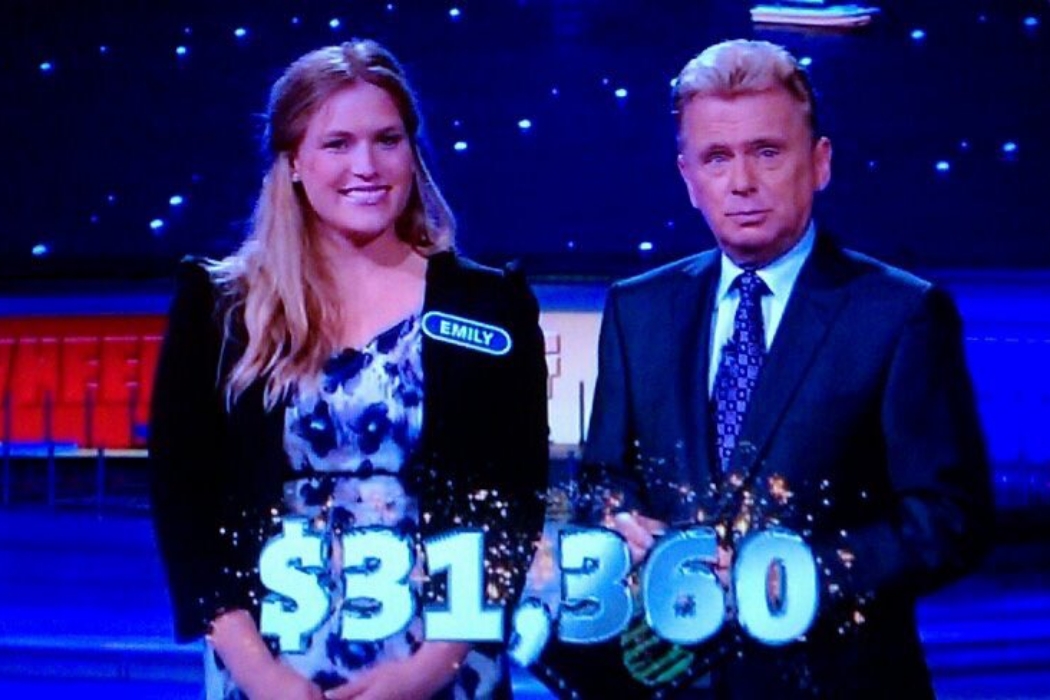 Woman and man on a game show set.