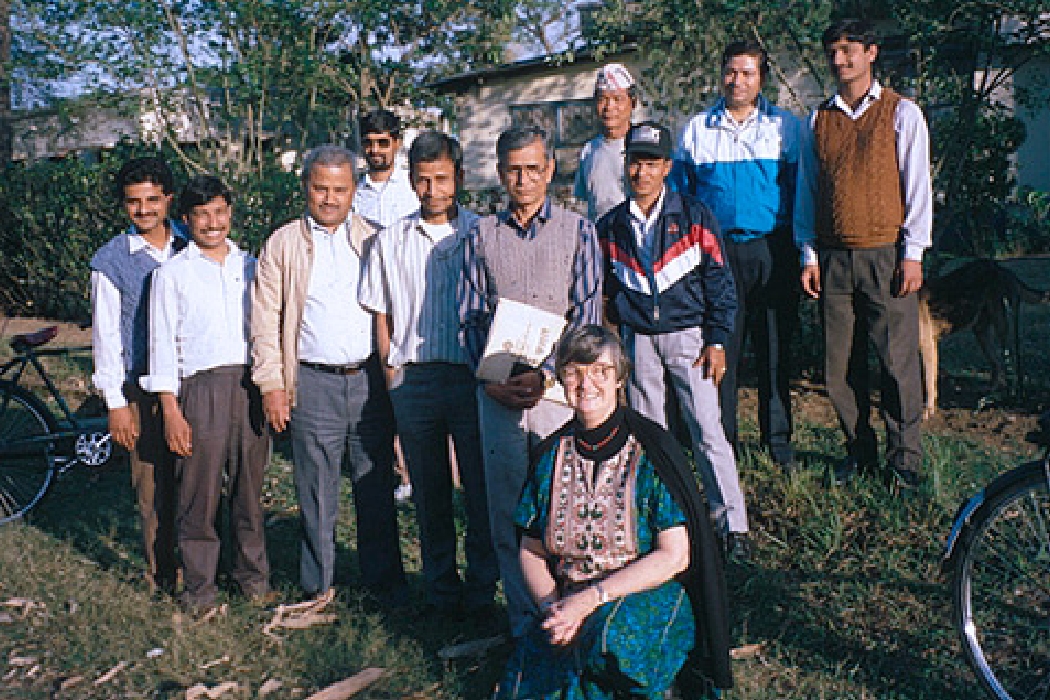 Elinor Ostrom with a group of people in Nepal
