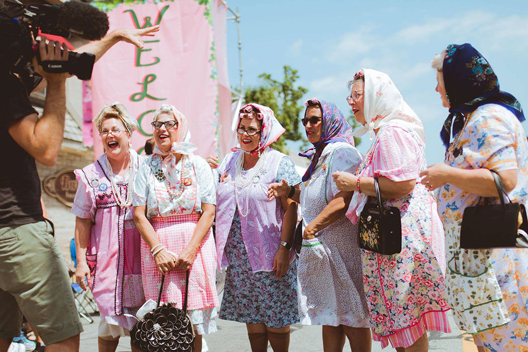 A group of women dressed as old ladies