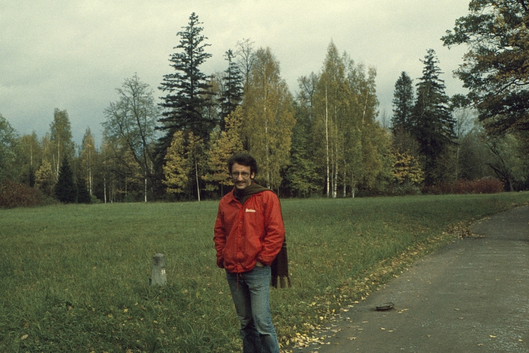 Allan Grafman in an IU jacket in front of a forest