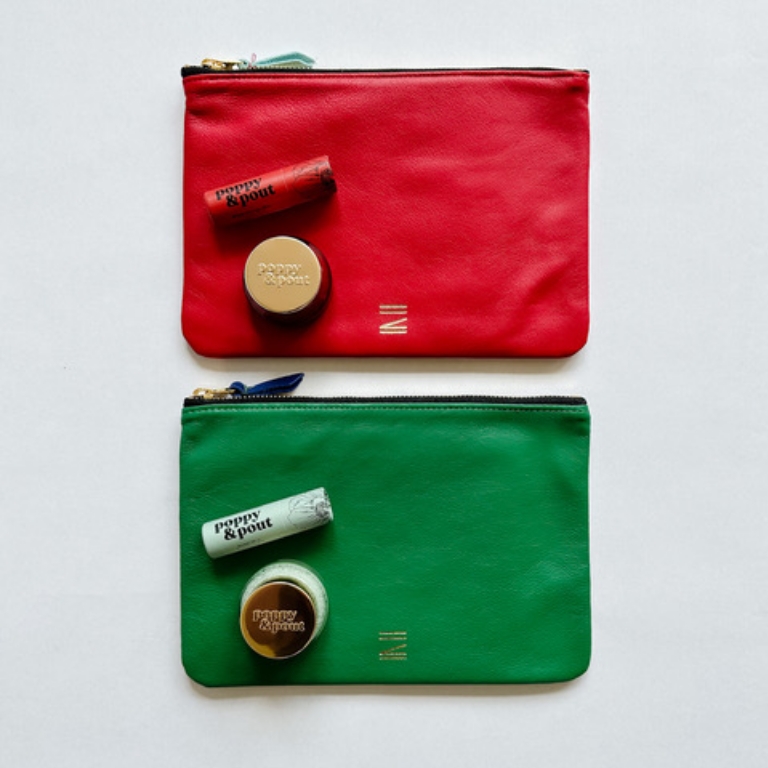 Red and green makeup pouches; red and green lipstick