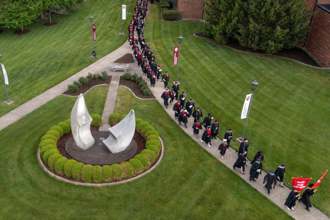 Students walking on campus for IU Southeast Commencement