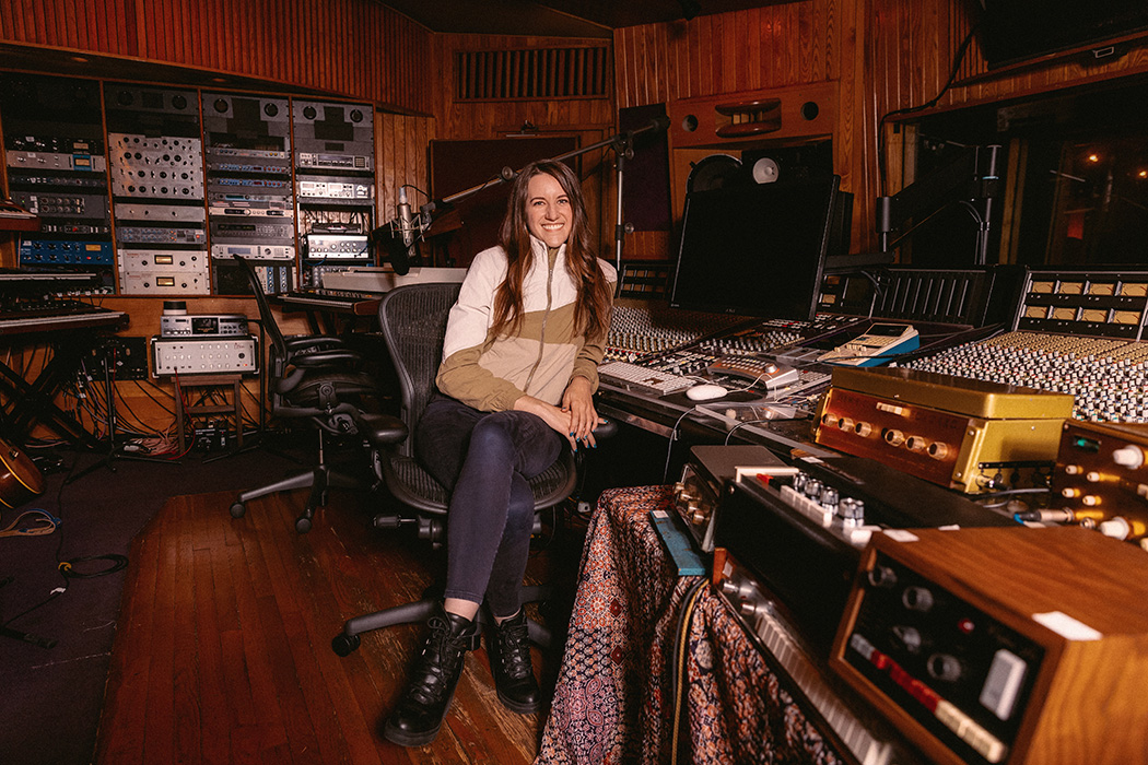 Woman sitting in a recording studio